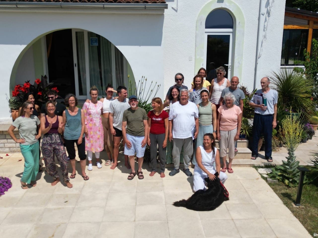 Retreat group gathered outside the villa at the HOMER Center